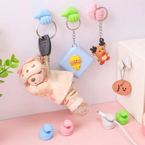Soporte Multifuncional con forma de Pulgar (Pack de 10 unidades)